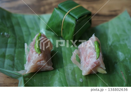 Authentic Thai Naem Moo or fermented pork sausage wrapped in banana leaf Authentic Thai Naem Moo or fermented pork sausage wrapped in banana leaf 138802636