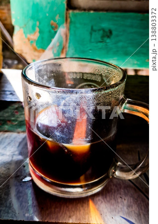 close up image of a cup of hot coffee with smoke coming from the cup close up image of a cup of hot coffee with smoke coming from the cup 138803372