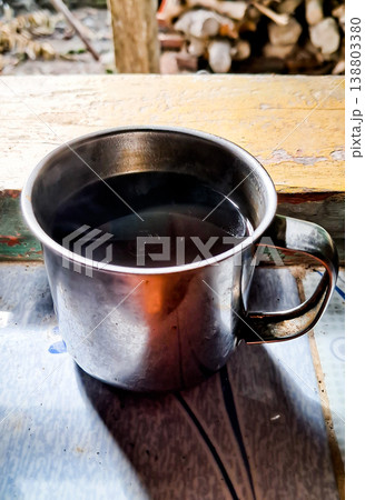 close up image of a cup of hot coffee with smoke coming from the cup close up image of a cup of hot coffee with smoke coming from the cup 138803380