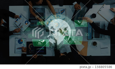 Business Team Collaborating on Sustainable Development Goals with Charts and Graphs Overlaid on a Digital Globe. Raster 138805586