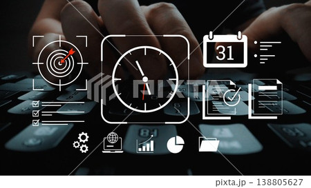 Hands typing on a keyboard with icons of time management, analytics, goals, and productivity displayed for a modern business setting Gluon Hands typing on a keyboard with icons of time management, analytics, goals, and productivity displayed for a modern business setting Gluon 138805627