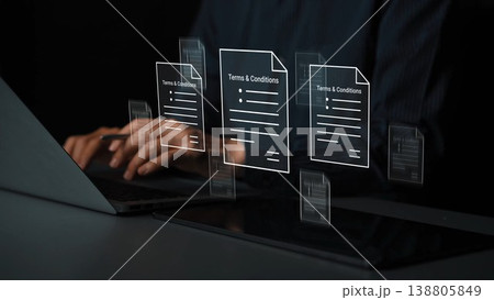 Digital Interaction with Floating Documents Displaying Terms and Conditions Above a Laptop in a Modern Workspace Gluon Digital Interaction with Floating Documents Displaying Terms and Conditions Above a Laptop in a Modern Workspace Gluon 138805849