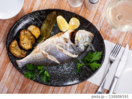 Delicious grilled gilthead bream with lemon 138806591