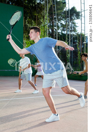 Young man playing frontenis on outdoor pelota court Young man playing frontenis on outdoor pelota court 138806641