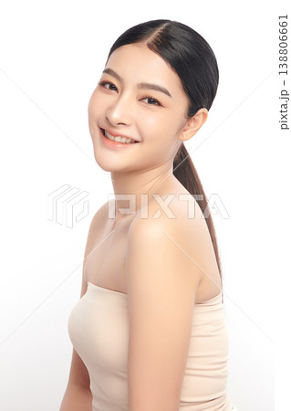 A beautiful young Asian woman with clean, fresh skin against a white background. Skincare, facial treatment, cosmetology, beauty, and spa. An elegant portrait of an Asian woman. A beautiful young Asian woman with clean, fresh skin against a white background. Skincare, facial treatment, cosmetology, beauty, and spa. An elegant portrait of an Asian woman. 138806661