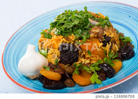 Pilau with lamb, dried plums and apricots 138806708