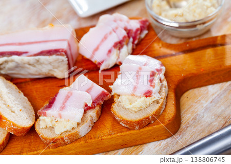 Sandwiches with salted pork belly and horseradish Sandwiches with salted pork belly and horseradish 138806745