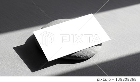 Blank white horizontal business card mockup placed on dark small stone textured grey background sharp dramatic sunlight shadow modern minimalist template stationery design empty Blank white horizontal business card mockup placed on dark small stone textured grey background sharp dramatic sunlight shadow modern minimalist template stationery design empty 138808869