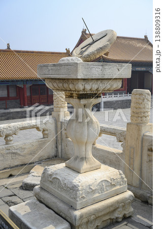 Ancient sundial on carved stone pedestal of 15th century in the Forbidden City in Beijing, China Ancient sundial on carved stone pedestal of 15th century in the Forbidden City in Beijing, China 138809316