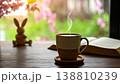 窓際のテーブルにあるマグカップと古い本03 138810239