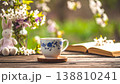 窓際のテーブルにあるマグカップと古い本05 138810241