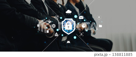 Business Professionals Engaged in Cybersecurity Discussion with Digital Icons Representing Data Protection and Network Security Concepts Quark Business Professionals Engaged in Cybersecurity Discussion with Digital Icons Representing Data Protection and Network Security Concepts Quark 138811885