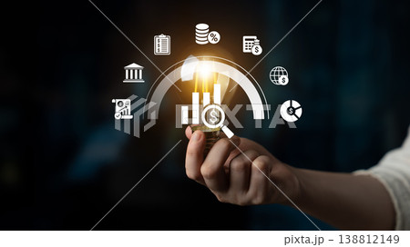 Person Holding Light Bulb with Financial Icons and Graphs Representing Innovation in Investment and Financial Growth Concepts Ledger 138812149