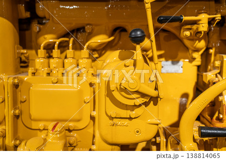 Close-Up of Vintage Tractor Engine in Yellow Industrial Detail Close-Up of Vintage Tractor Engine in Yellow Industrial Detail 138814065