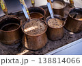 Traditional Turkish Coffee Brewing in Copper Cezve on Sand 138814066