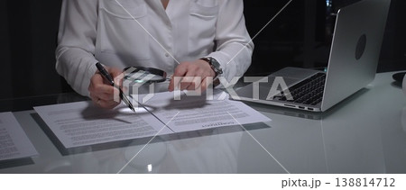 Woman analyzing contract text with magnifying glass, scrutinizing fine print for legal details and agreement review. Audit, business and overworking concepts Woman analyzing contract text with magnifying glass, scrutinizing fine print for legal details and agreement review. Audit, business and overworking concepts 138814712