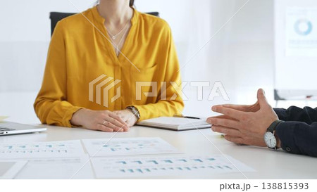 Business professionals discussing financial charts, collaborating on data analysis and strategic planning in contemporary workplace setting with graphs and reports Business professionals discussing financial charts, collaborating on data analysis and strategic planning in contemporary workplace setting with graphs and reports 138815393