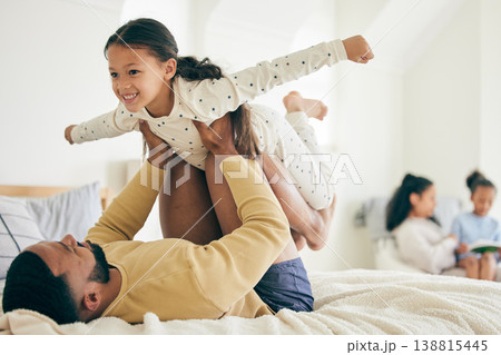 Happy family, airplane and father with girl child on a bed for playing, bond and relax in their home together. Flying, play and kid with parent in a bedroom with vacation freedom, wake up and smile 138815445