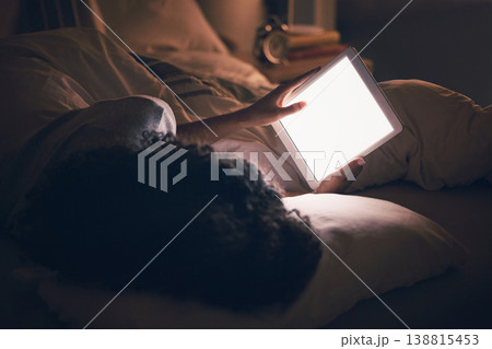 Woman, tablet and bed in night with blank blank, reading and typing for contact, chat or social media app. Girl, digital touchscreen and mockup space with empty ux, scroll or watch video in dark home 138815453