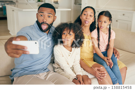 Funny face, family and selfie in home living room, bonding together and relax. Smile, profile picture and children with mother and father taking photo for happy memory on social media, love and care Funny face, family and selfie in home living room, bonding together and relax. Smile, profile picture and children with mother and father taking photo for happy memory on social media, love and care 138815458
