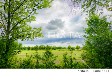 A Serene Landscape Featuring Lush Greenery Accompanied by Cloudy Skies that Inspire Calmness A Serene Landscape Featuring Lush Greenery Accompanied by Cloudy Skies that Inspire Calmness 138815554