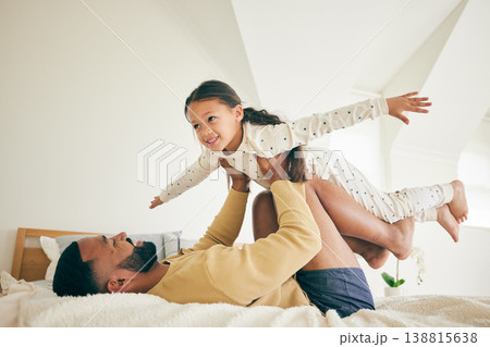 Family, airplane and father with girl child on a bed for playing, bond and relax in their home together. Flying, play and happy kid with parent in a bedroom with vacation freedom, wake up and smile Family, airplane and father with girl child on a bed for playing, bond and relax in their home together. Flying, play and happy kid with parent in a bedroom with vacation freedom, wake up and smile 138815638