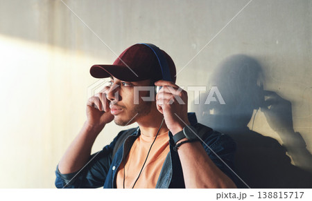 Man, student with headphones and music on campus, future mindset and audio against wall background. Gen z, education and male person thinking while at college, tech with radio and podcast streaming 138815717