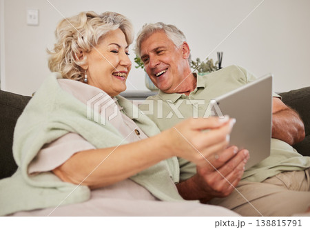 Senior couple, relax and tablet on sofa in home living room for love, movies and streaming internet show. Happy woman, elderly man and digital technology for social media, reading news app or website Senior couple, relax and tablet on sofa in home living room for love, movies and streaming internet show. Happy woman, elderly man and digital technology for social media, reading news app or website 138815791