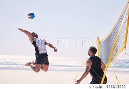 Beach, volleyball serve and team with competition at ocean and sea with exercise, sport and fitness. Summer, outdoor and training people playing for health, action game and workout activity in nature Beach, volleyball serve and team with competition at ocean and sea with exercise, sport and fitness. Summer, outdoor and training people playing for health, action game and workout activity in nature 138815952