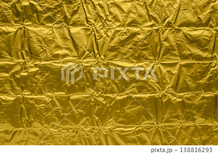 Luxury shiny metallic golden foil crumpled texture background Luxury shiny metallic golden foil crumpled texture background 138816293