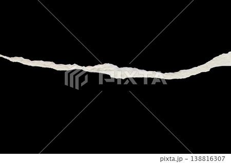 Ripped torn paper edges isolated on black background 138816307
