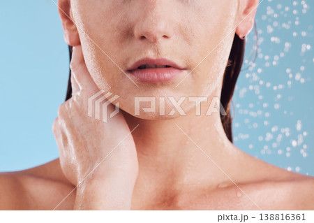 Woman, hands and shower in water for hygiene, cleaning or self love and body care against a blue studio background. Closeup of female person in skincare, rain or wash for cleanliness or grooming Woman, hands and shower in water for hygiene, cleaning or self love and body care against a blue studio background. Closeup of female person in skincare, rain or wash for cleanliness or grooming 138816361
