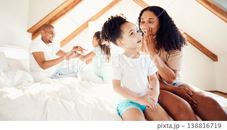Family, playing and fun in a bedroom with hand, games and bonding in their home together. Love, relax and children with parent on a bed with secret, gossip or surprise on the weekend in a house Family, playing and fun in a bedroom with hand, games and bonding in their home together. Love, relax and children with parent on a bed with secret, gossip or surprise on the weekend in a house 138816719