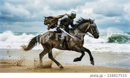 Armored knight charges on a galloping horse along a windswept beach. Tattered cape whips behind the rider under a stormy sky conveying dramatic intensity. 138817533