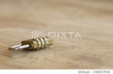 Combination brass padlock on wooden surface for security and data protection concept Combination brass padlock on wooden surface for security and data protection concept 138817658
