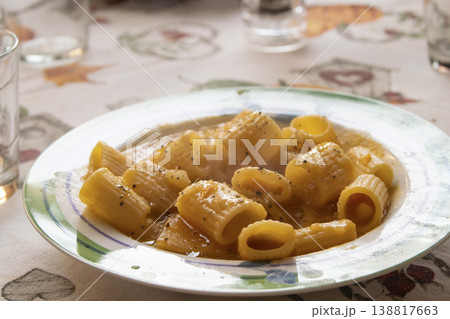 Rigatoni pasta with creamy sauce and black pepper on patterned plate Rigatoni pasta with creamy sauce and black pepper on patterned plate 138817663