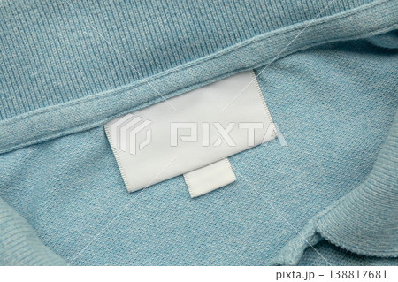 White blank laundry care clothes label on shirt fabric background 138817681