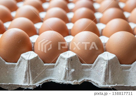 Fresh organic brown chicken eggs in cardboard tray Fresh organic brown chicken eggs in cardboard tray 138817711