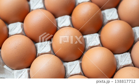 Fresh organic brown chicken eggs in cardboard tray Fresh organic brown chicken eggs in cardboard tray 138817712