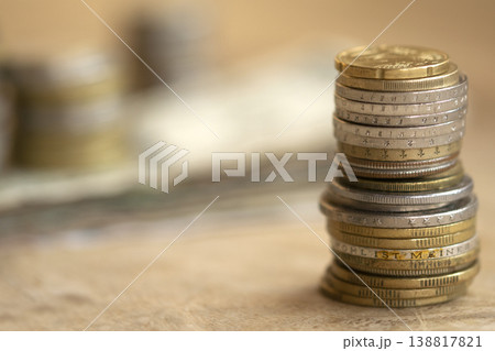 Stacks of international coins and banknotes on wooden table for finance Stacks of international coins and banknotes on wooden table for finance 138817821