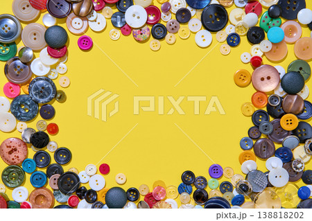 Colorful button border frame with copy space on yellow background 138818202