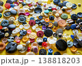Colorful sewing buttons on bright yellow background 138818203