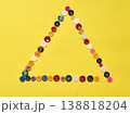 Triangle frame made of colorful buttons 138818204