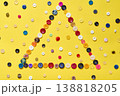 Triangle frame made of colorful buttons 138818205