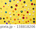 Colorful sewing buttons on bright yellow background 138818206