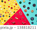 Colorful sewing accessories composition on geometric background, buttons and metal buckles 138818211