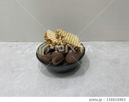 bowl of sweets isolated on gray background 138818963