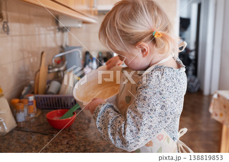 Independent preschooler: little 4 year old girl baking a homemade pie alone in a cozy kitchen 138819853