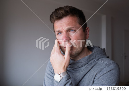 a distressed middle aged man feeling overwhelmed and stuck in a difficult situation a distressed middle aged man feeling overwhelmed and stuck in a difficult situation 138819890