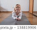 Cute preschooler lying on the floor and smiling before yoga practice. 138819906